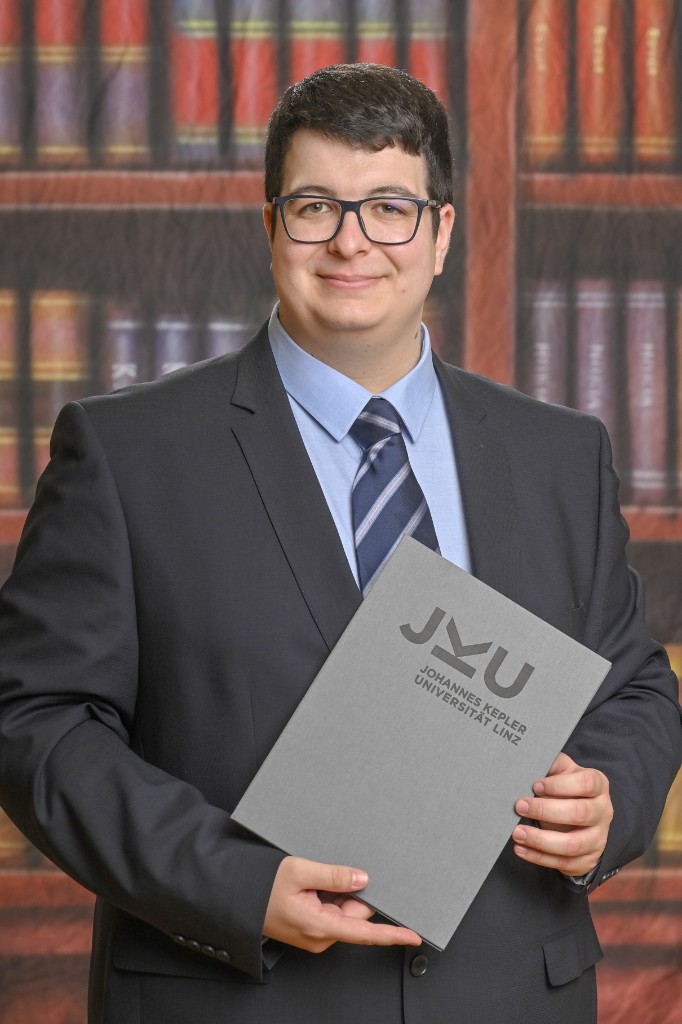 Graduation portrait at Johannes Kepler University Linz